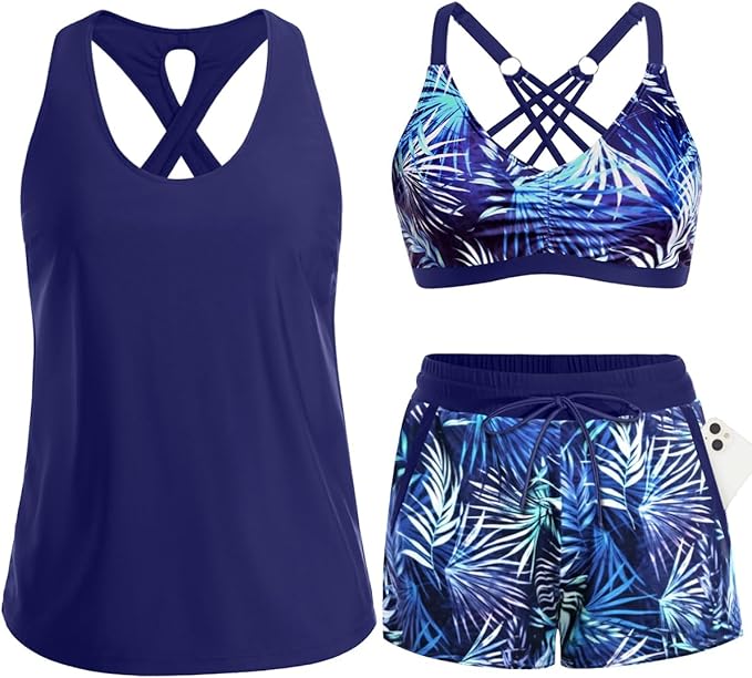 Flat-lay of a 3-piece athletic tankini swimwear set in navy blue and tropical palm leaf print.