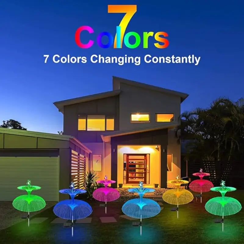 Seven color-changing solar jellyfish lights glowing brightly on a modern villa lawn at twilight.