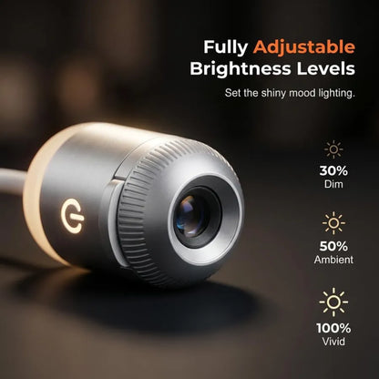 Close-up of the metallic finish projection lens highlighting three adjustable brightness levels: 30 percent dim, 50 percent ambient, and 100 percent vivid.