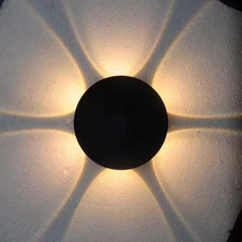 A round 6-beam magnetic rechargeable floral night light casting a decorative warm glow, highlighting the distinct light projection pattern.