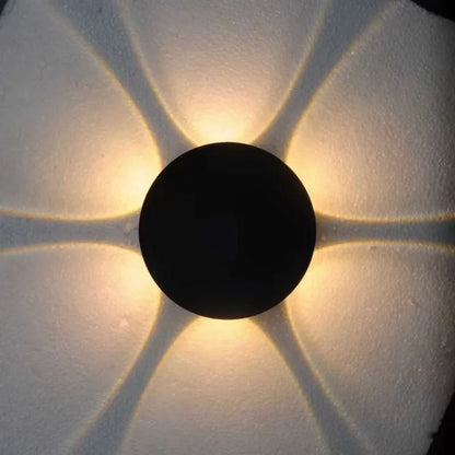 A round 6-beam magnetic rechargeable floral night light casting a decorative warm glow, highlighting the distinct light projection pattern.